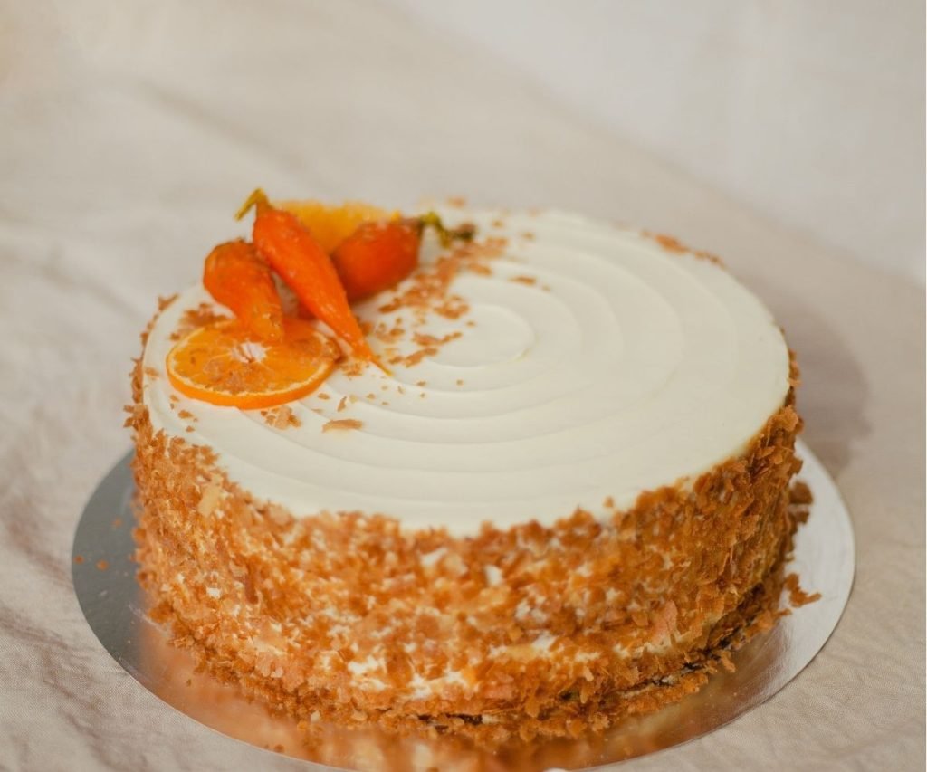 Mary Berry carrot cake with cream cheese frosting and walnut halves