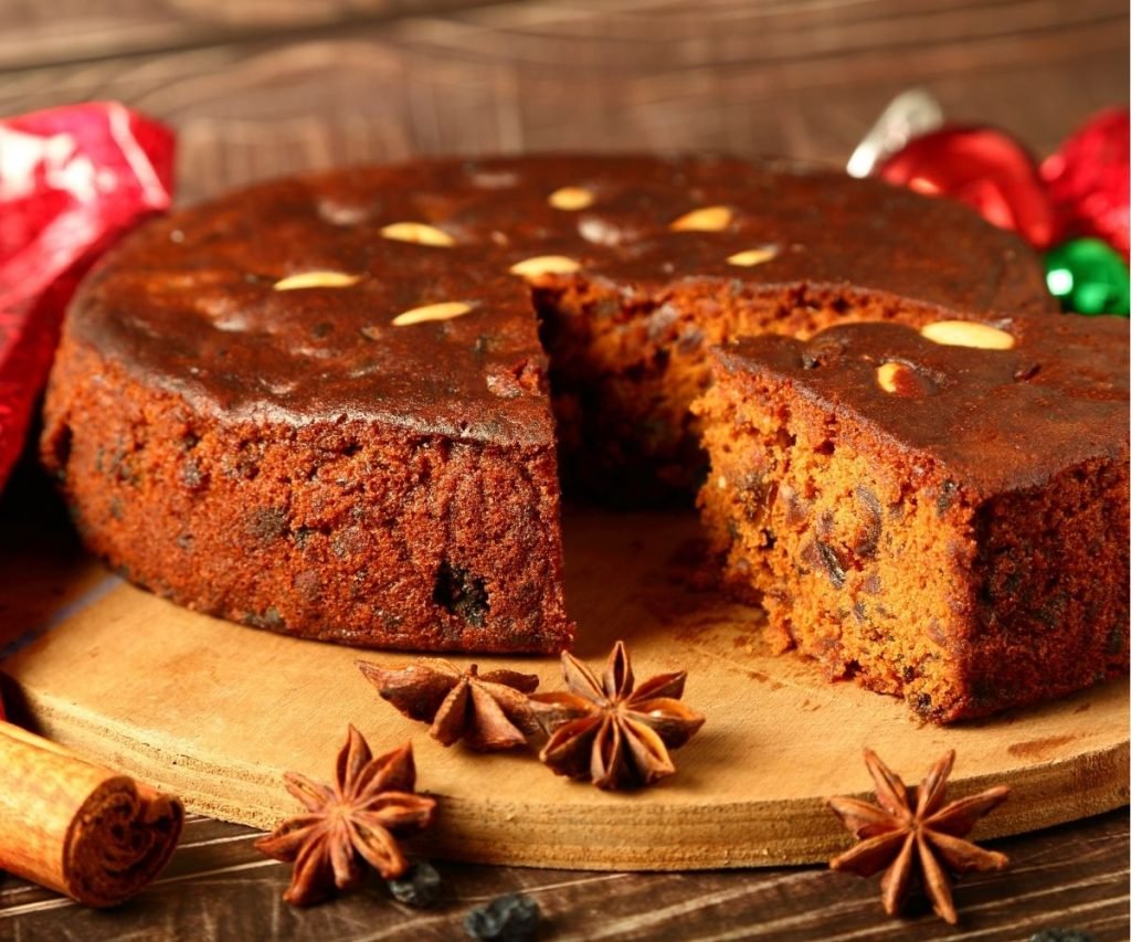 Mary Berry rich fruit cake topped with whole almonds and cherries