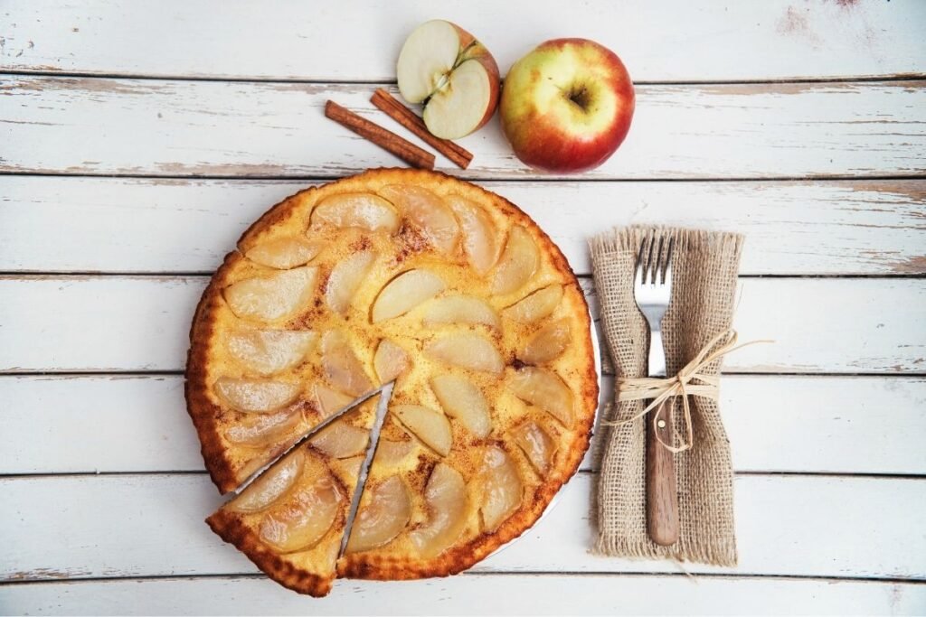 A spread of apple desserts including pie, crumble and spiced apple cake