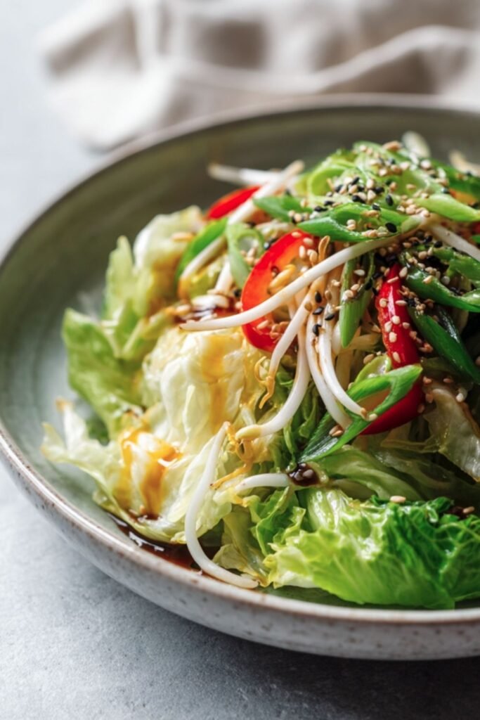 Crunchy Asian salad with bean sprouts, scallions and toasted sesame seeds