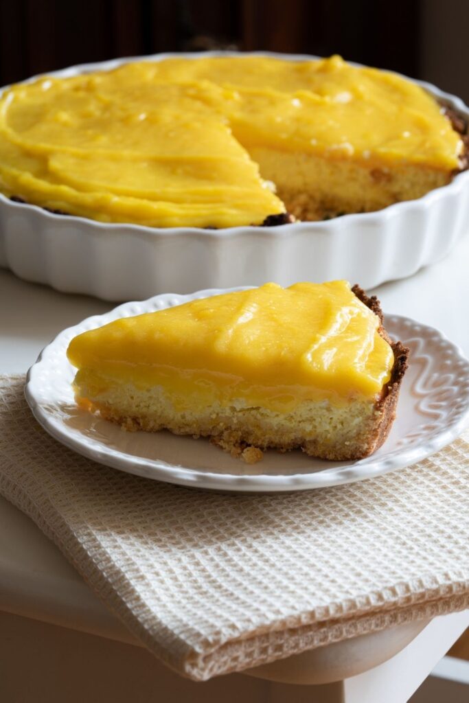 Mary Berry lemon curd cheesecake dusted with confectioners sugar